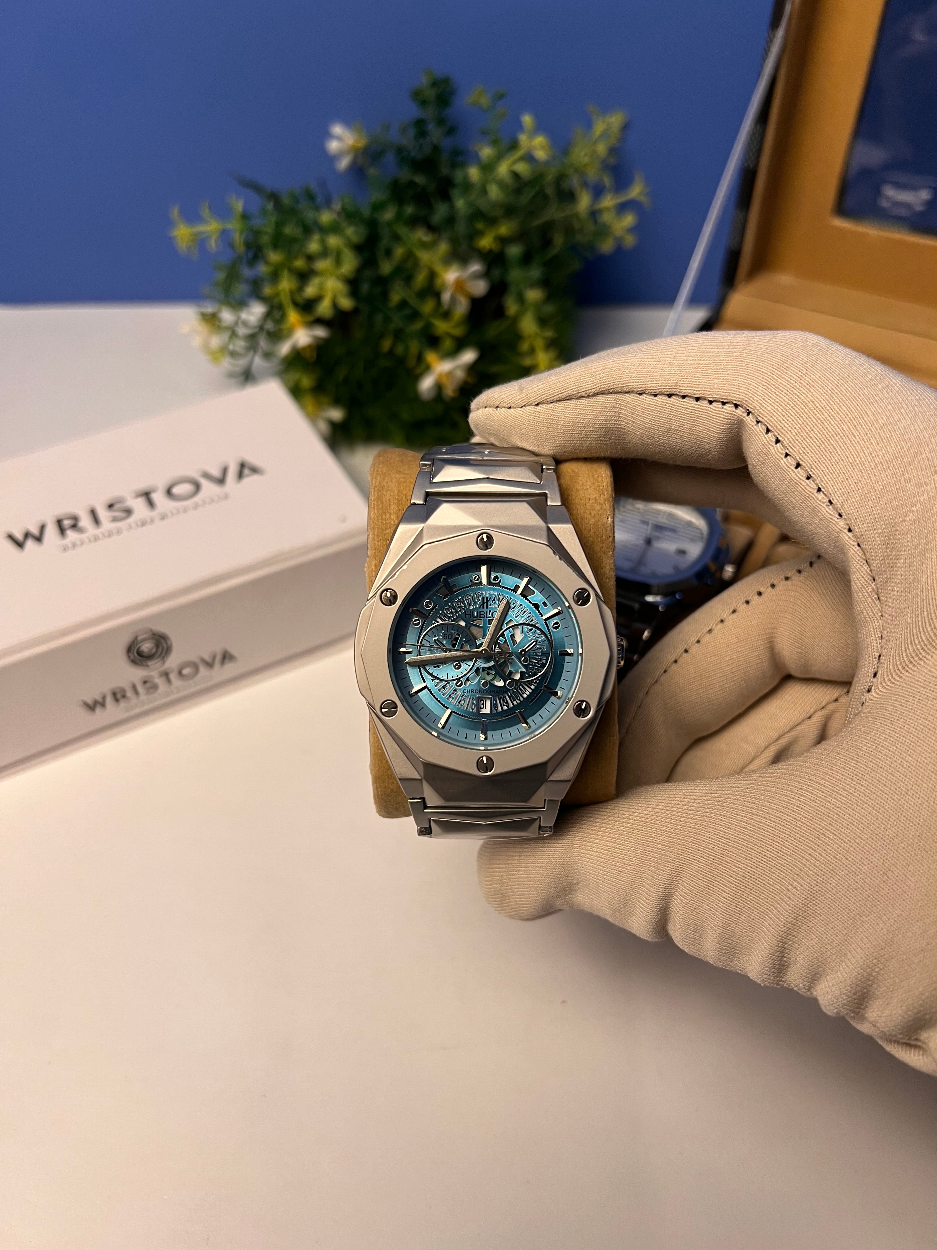 Hublot Diamond cut with a metallic case and a blue dial.